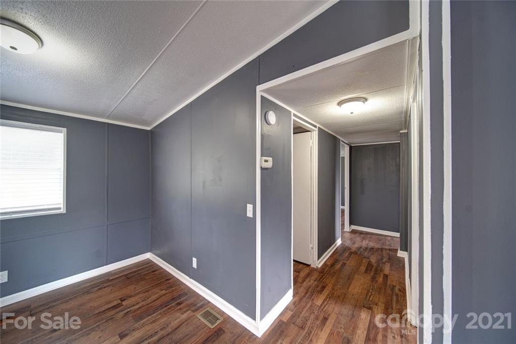 283 Ballard Spring Road, Unit 3276 Morven, NC 28119 - Photo 14 of 48 a view of hallway with wooden floor