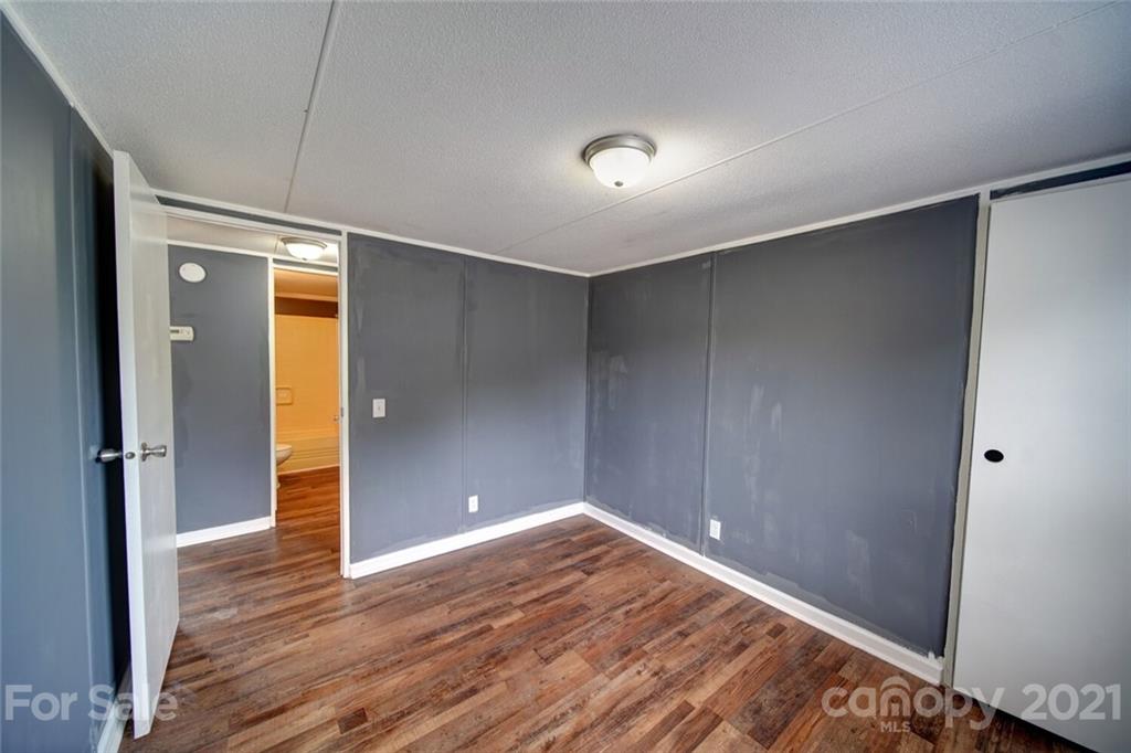 283 Ballard Spring Road, Unit 3276 Morven, NC 28119 - Photo 40 of 48 a view of empty room with wooden floor