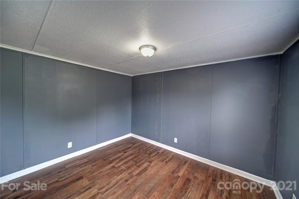 283 Ballard Spring Road, Unit 3276 Morven, NC 28119 - Photo 47 of 48 a view of an empty room with wooden floor
