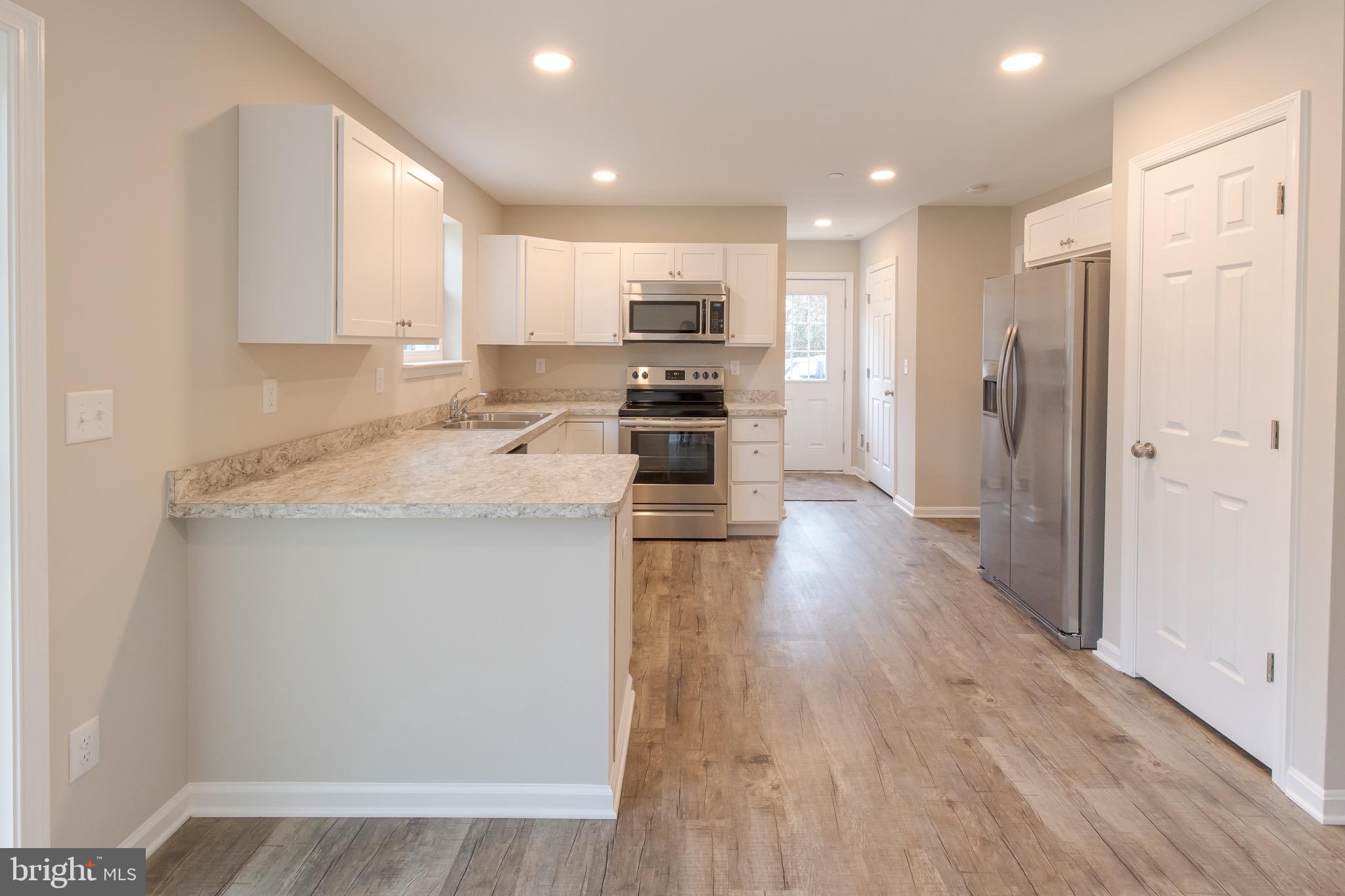 Open, bright Kitchen/ dining area.