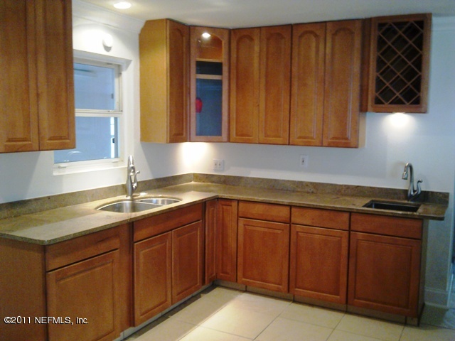 7442 Stonehurst Road South Jacksonville, FL 32277 - Photo 5 of 6 a kitchen with a sink and cabinets