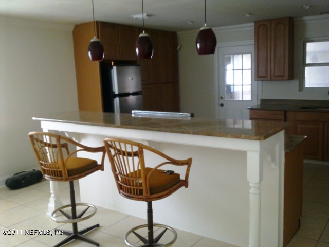 7442 Stonehurst Road South Jacksonville, FL 32277 - Photo 6 of 6 a kitchen with a chandelier