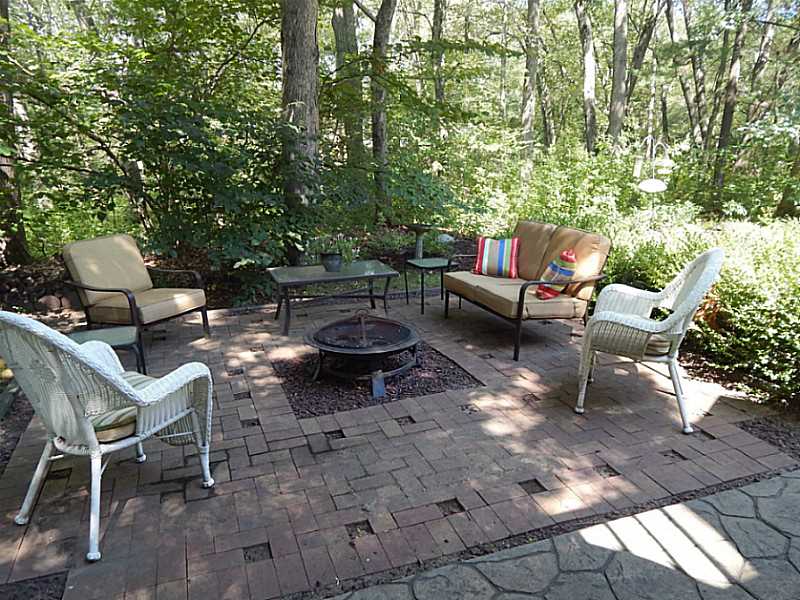 340 Devils Foot Road North Kingstown, RI 02852 - Photo 4 of 24 Exterior Back. Beautiful brick patio in backyard
