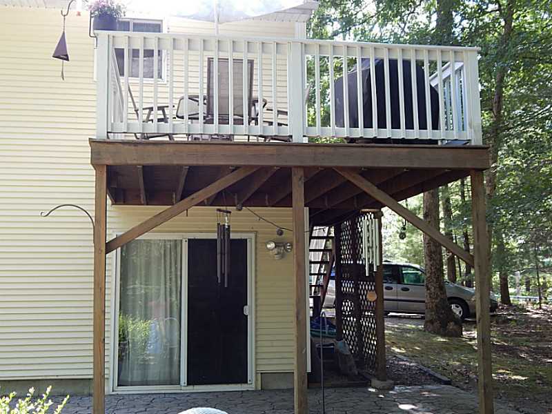 340 Devils Foot Road North Kingstown, RI 02852 - Photo 6 of 24 Exterior Back. View of the deck from the patio