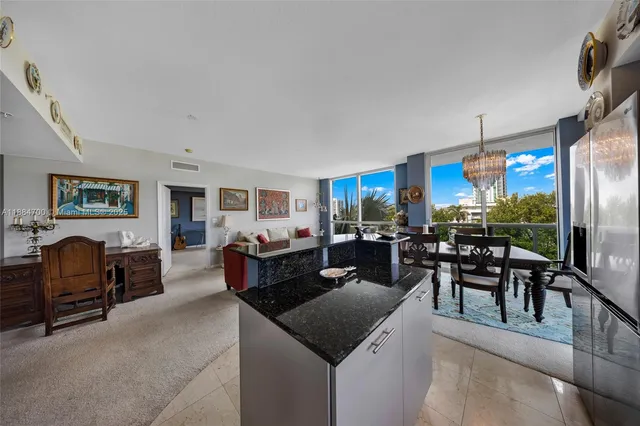 a living room with furniture and a dining area