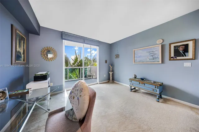 a view of a livingroom with furniture and a window
