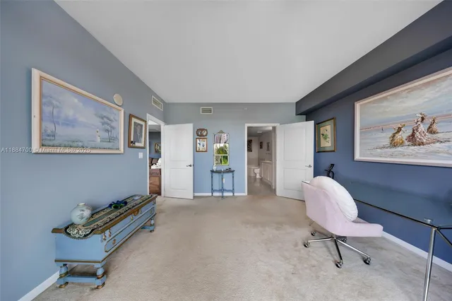 a living room with furniture and a chair