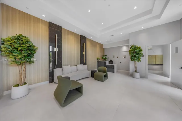 a living room with furniture and potted plant