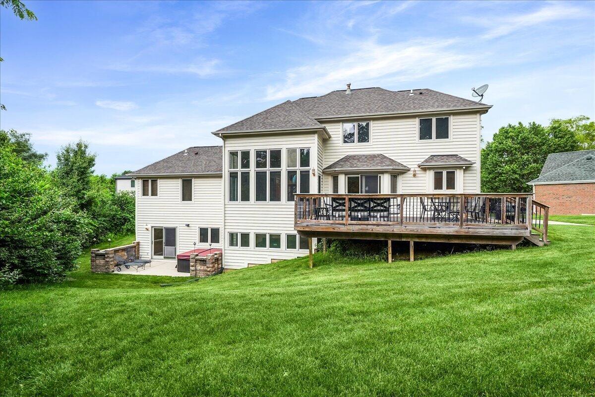 8751 Bridgewater Court Crown Point, IN 46307 - Photo 9 of 49 a view of a house with a yard and sitting area