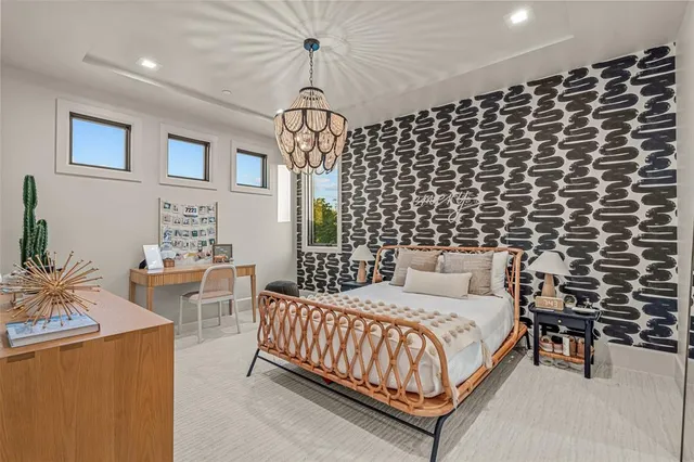 a view of living room with furniture and a floor to ceiling window