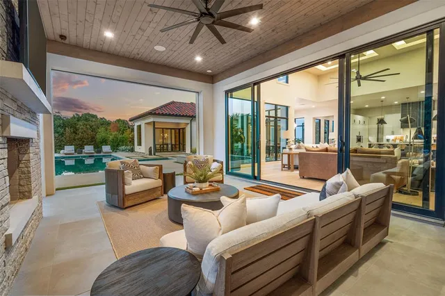 a view of a patio with a table and chairs