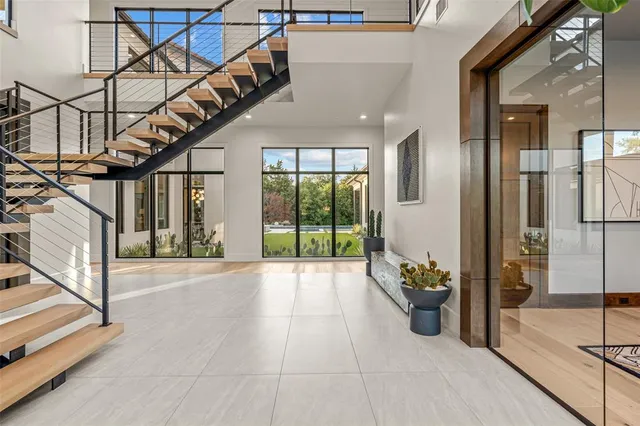 a lobby with furniture and stairs