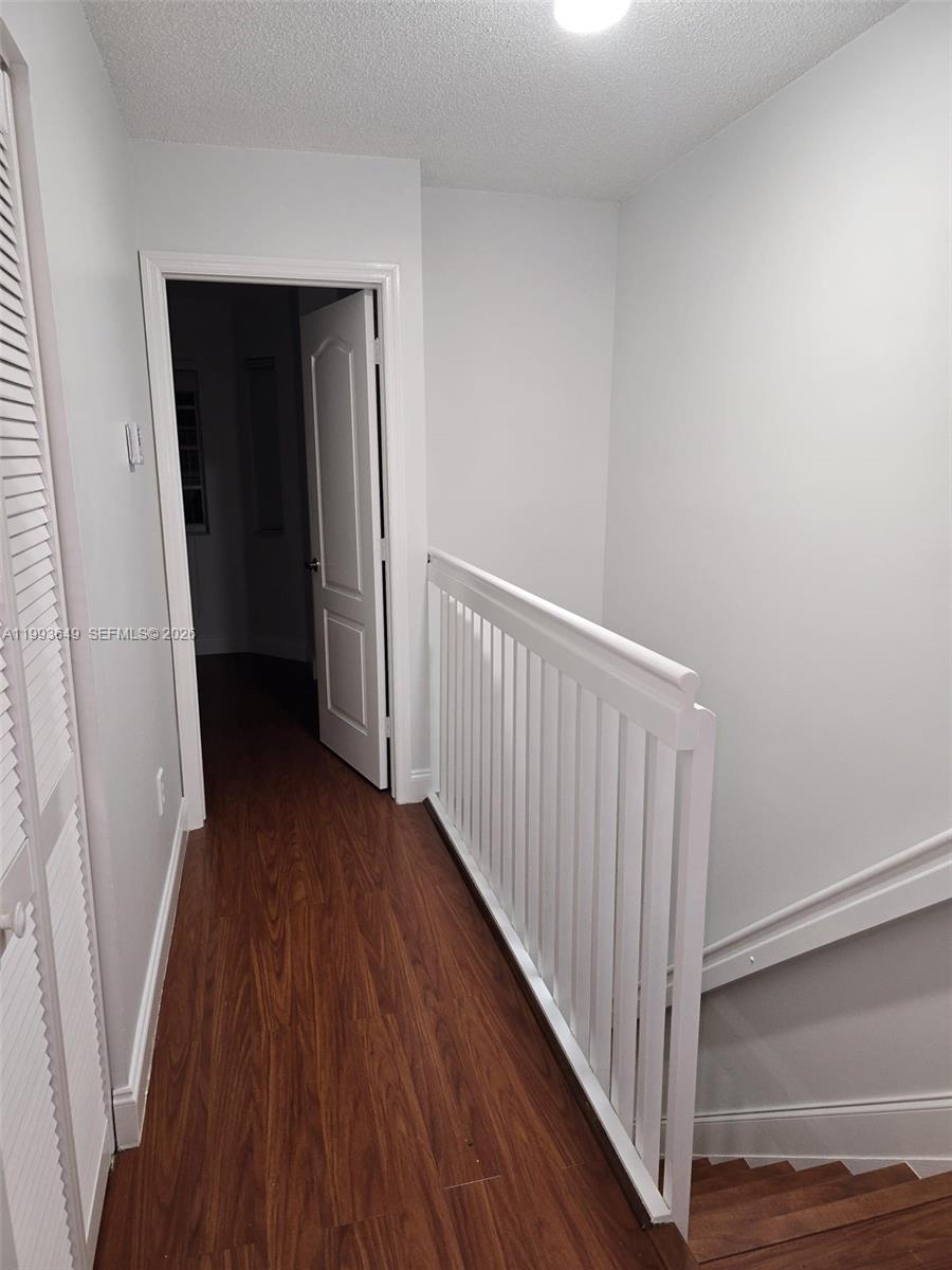 14272 Southwest 121st Place, Unit 9 Miami, FL 33186 - Photo 13 of 17 a view of a hallway