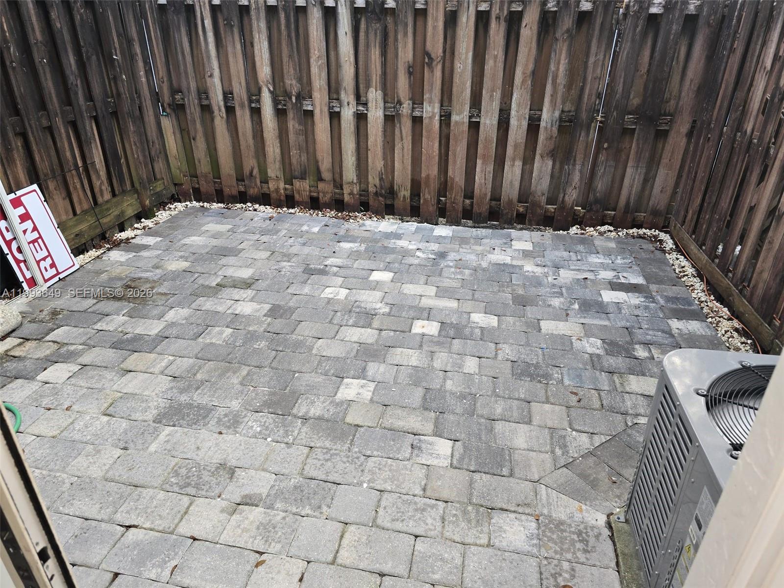 14272 Southwest 121st Place, Unit 9 Miami, FL 33186 - Photo 17 of 17 a view of wooden fence