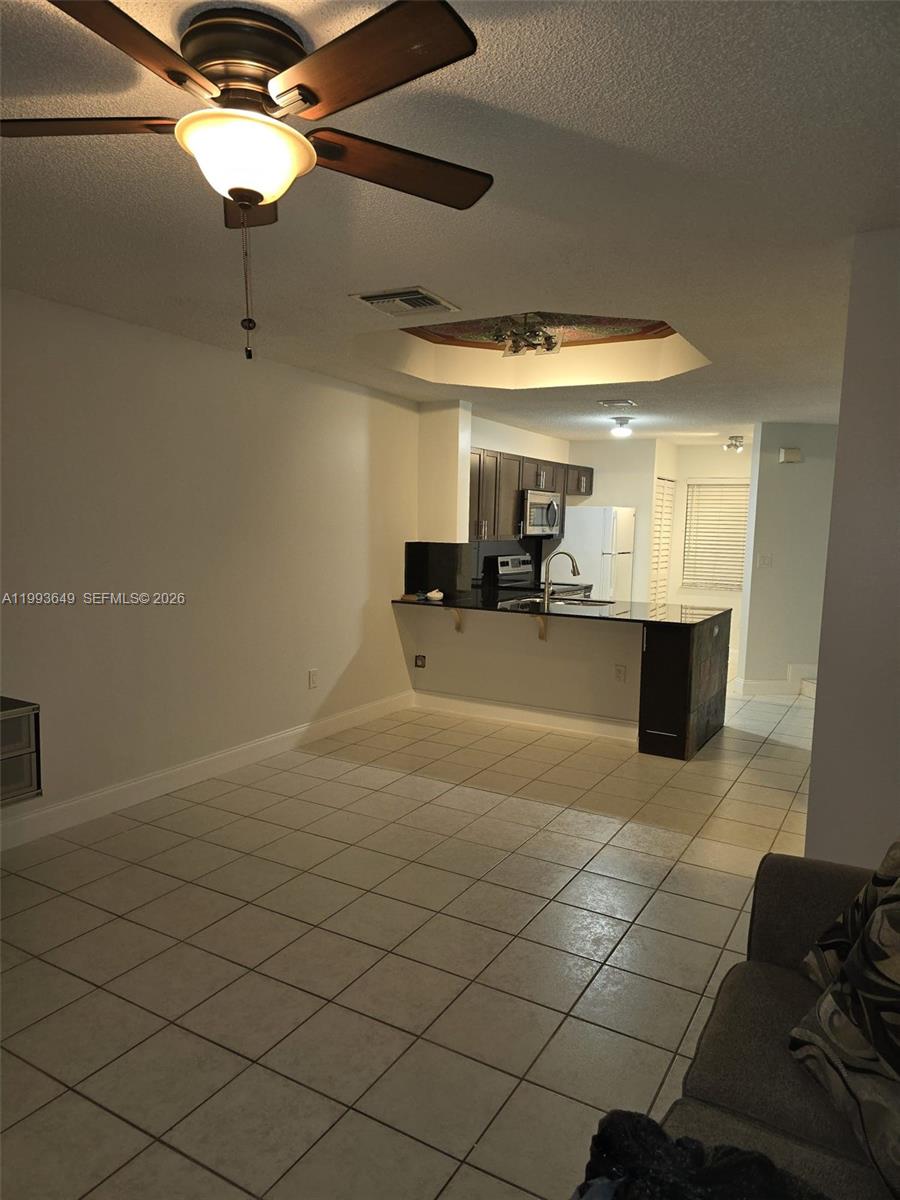 14272 Southwest 121st Place, Unit 9 Miami, FL 33186 - Photo 4 of 17 a view of a garage