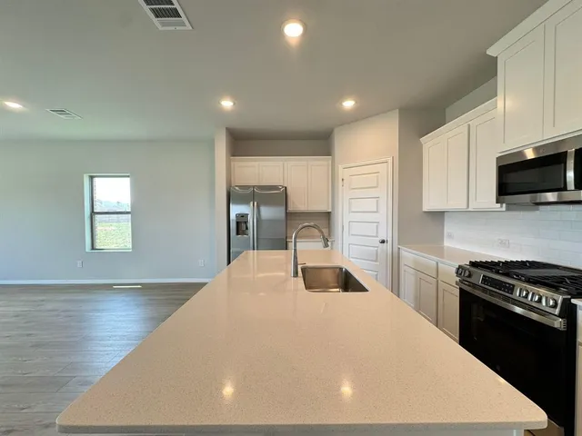 a bathroom with a sink double vanity and a mirror