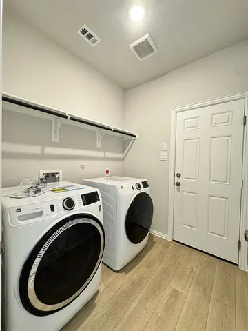 a bathroom with a sink toilet a mirror and shower