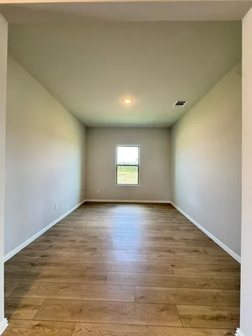 a view of an empty room and window