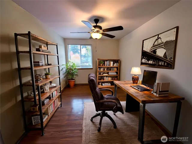 a view of a workspace with furniture and a workspace