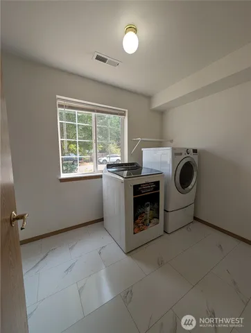 a utility room with dryer and washer