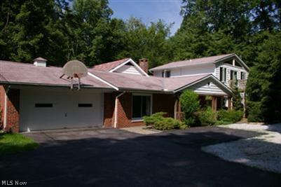 8353 Chagrin Road Chagrin Falls, OH 44023 - Photo 1 of 1 Surrounded by Trees along the circular drive rests this spacious and immaculate home in the heart of Bainbridge.