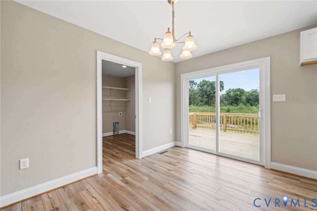 531 Salem Church Road Cumberland, VA 23040 - Photo 11 of 26 wooden floor in an empty room with a window