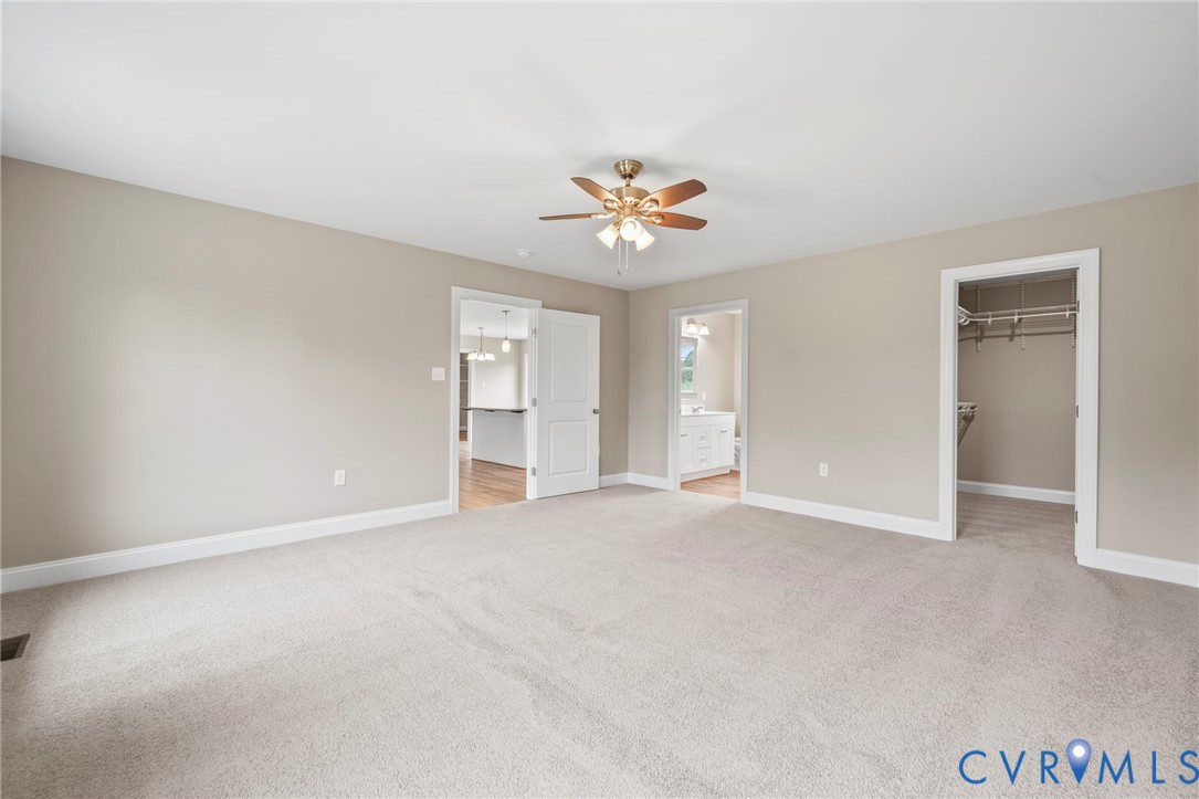 531 Salem Church Road Cumberland, VA 23040 - Photo 14 of 26 an empty room with closet and a ceiling fan