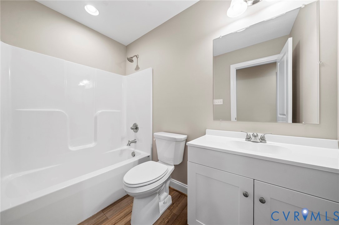 531 Salem Church Road Cumberland, VA 23040 - Photo 22 of 26 a bathroom with a sink a toilet and shower