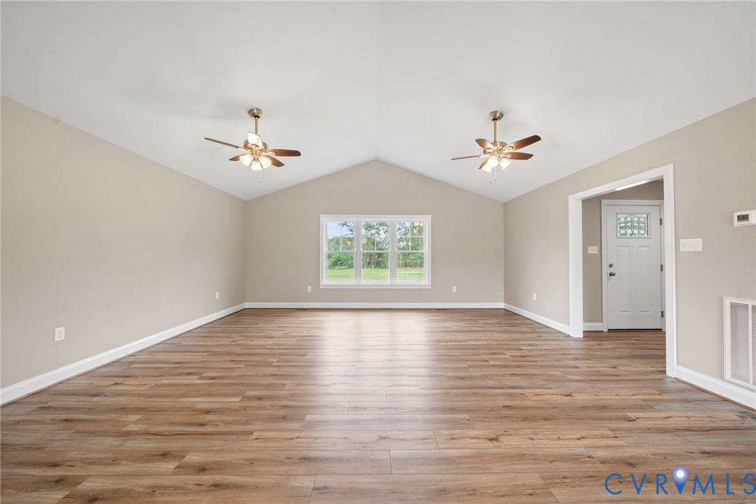 531 Salem Church Road Cumberland, VA 23040 - Photo 5 of 26 a view of an empty room with wooden floor and a window