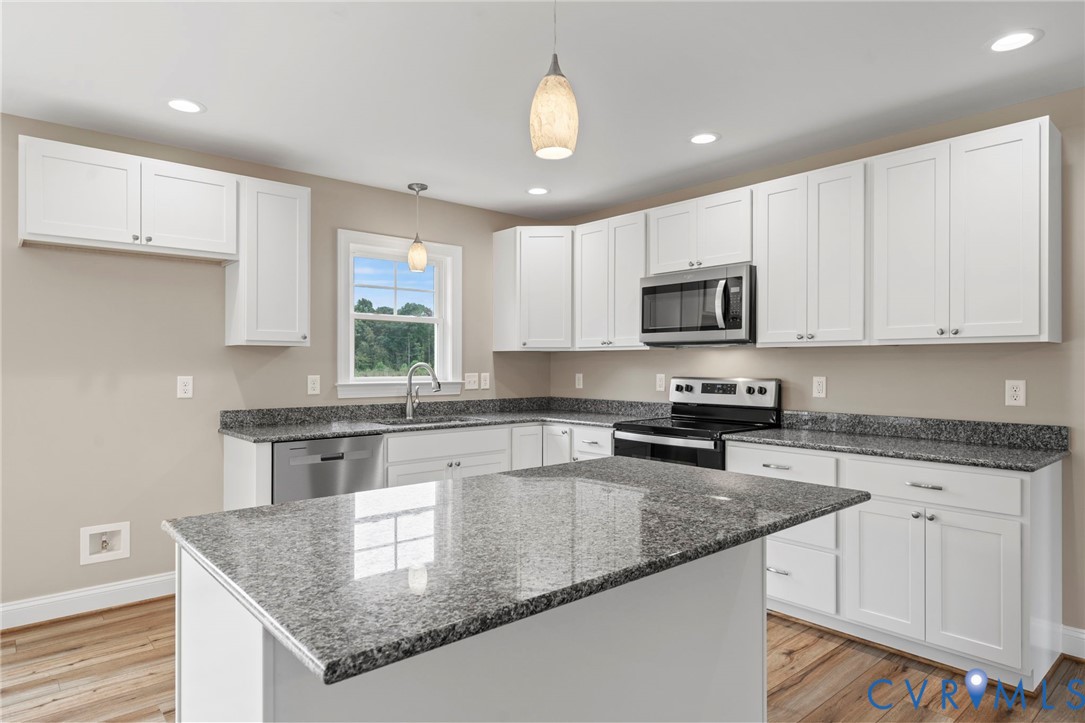 531 Salem Church Road Cumberland, VA 23040 - Photo 9 of 26 a kitchen with granite countertop a stove sink and microwave