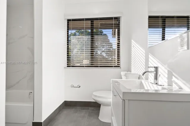 a workspace with furniture and window