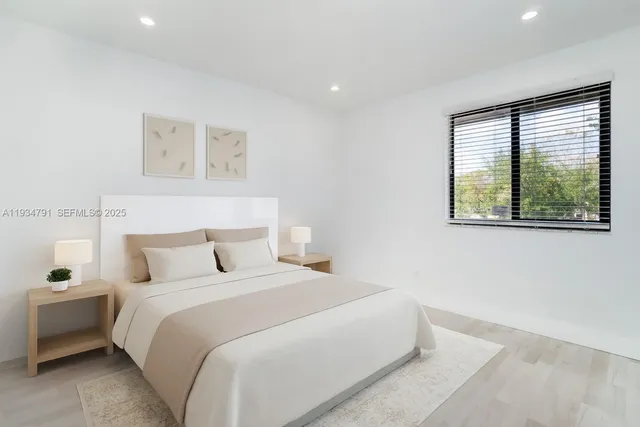 a bathroom with a toilet a sink and a window