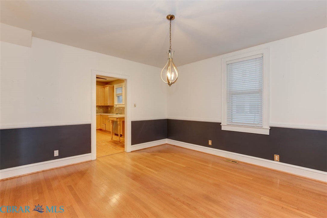 144 Meredith Street Hampton, VA 23669 - Photo 13 of 36 a view of empty room with window and ceiling fan