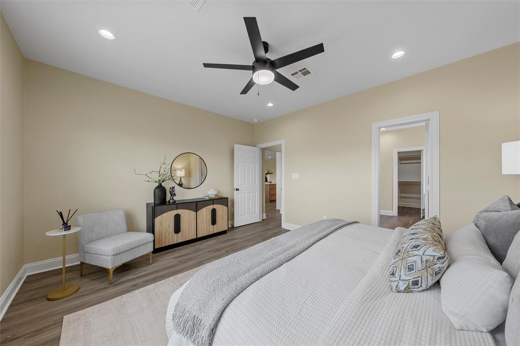 929 Northern Dancer Drive Hewitt, TX 76643 - Photo 16 of 36 a bedroom with a bed and a chandelier
