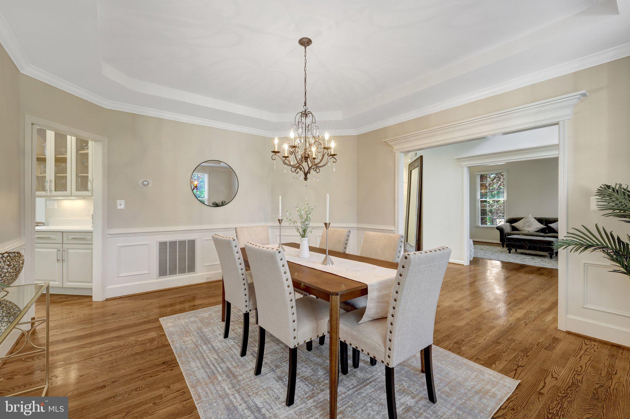 1827 Beulah Road Vienna, VA 22182 - Photo 17 of 91 a dining room with furniture a chandelier and wooden floor