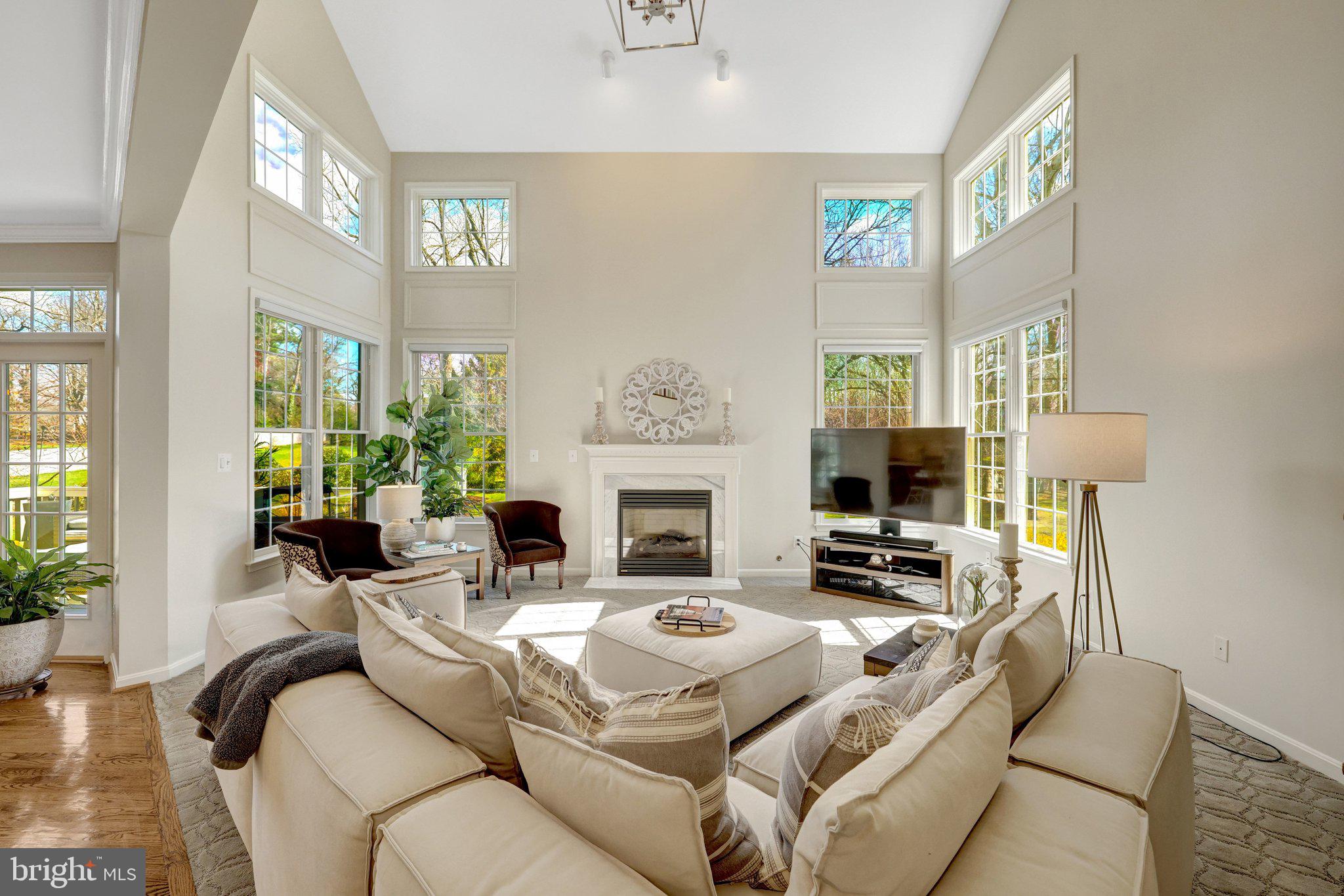 1827 Beulah Road Vienna, VA 22182 - Photo 19 of 91 a living room with furniture a fireplace and a large mirror