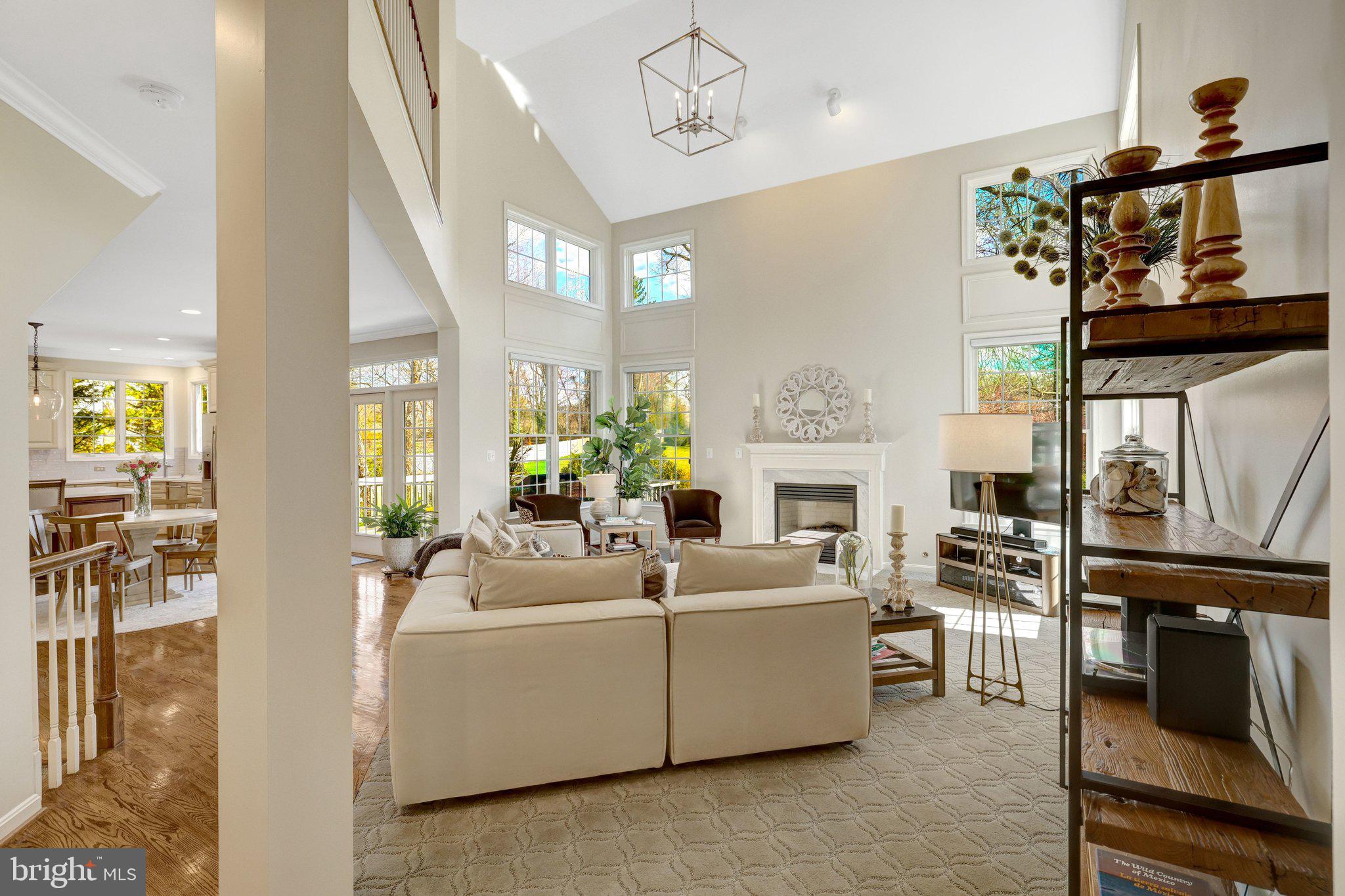 1827 Beulah Road Vienna, VA 22182 - Photo 20 of 91 a living room with furniture a fireplace and a flat screen tv
