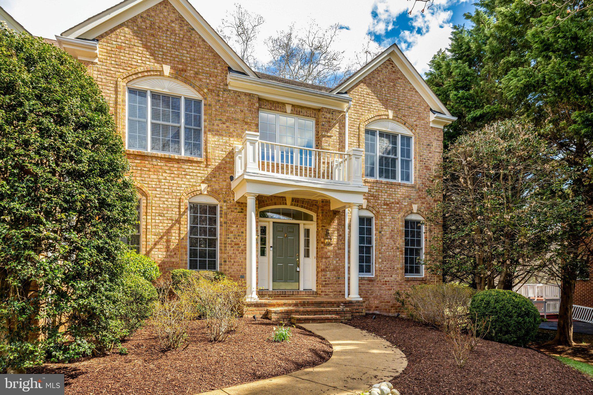 1827 Beulah Road Vienna, VA 22182 - Photo 2 of 91 a front view of a house with a yard and garage