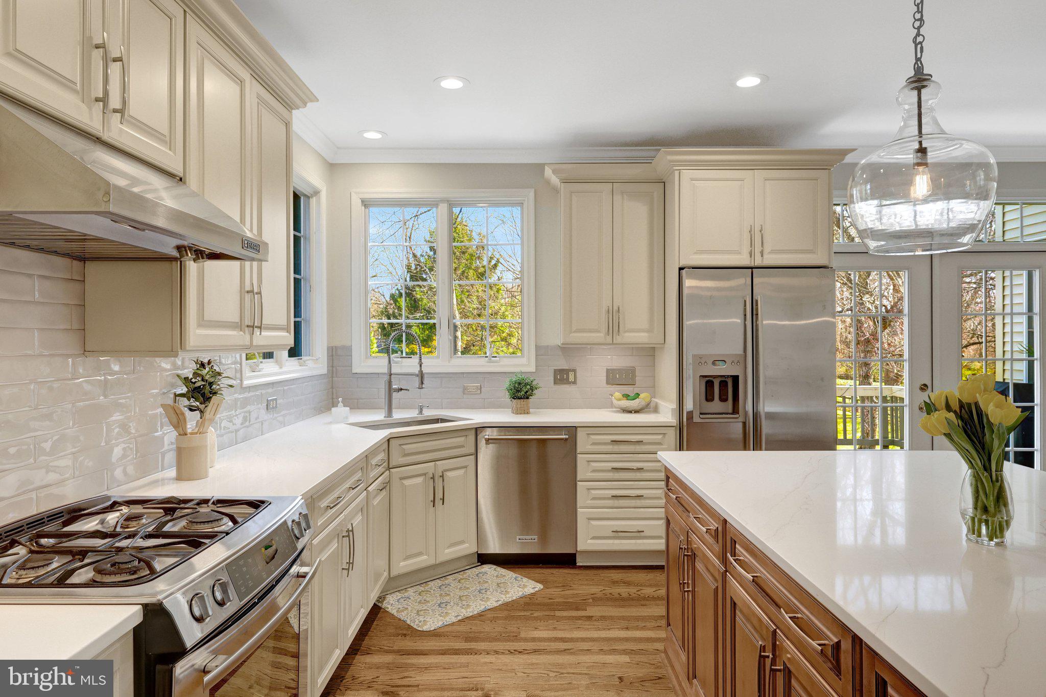 1827 Beulah Road Vienna, VA 22182 - Photo 30 of 91 a kitchen with stainless steel appliances granite countertop a sink stove and refrigerator