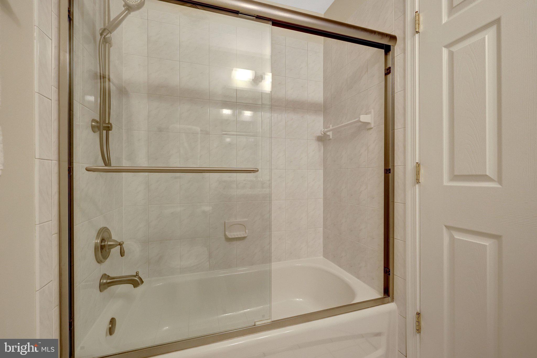 1827 Beulah Road Vienna, VA 22182 - Photo 50 of 91 a bathroom with a glass shower door