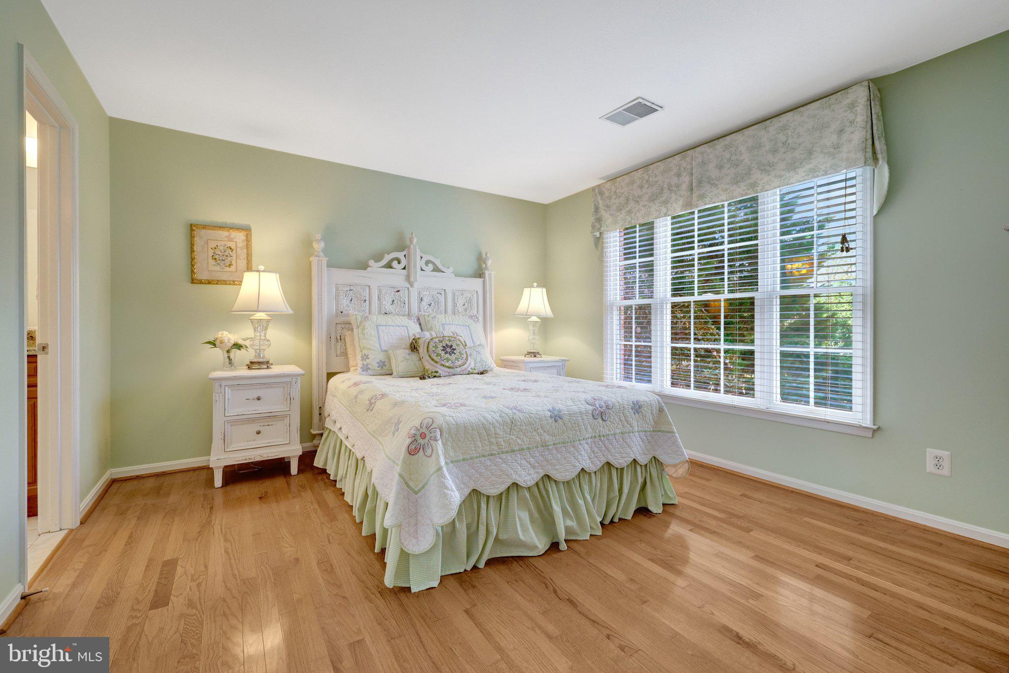 1827 Beulah Road Vienna, VA 22182 - Photo 51 of 91 a bedroom with a bed and wooden floor