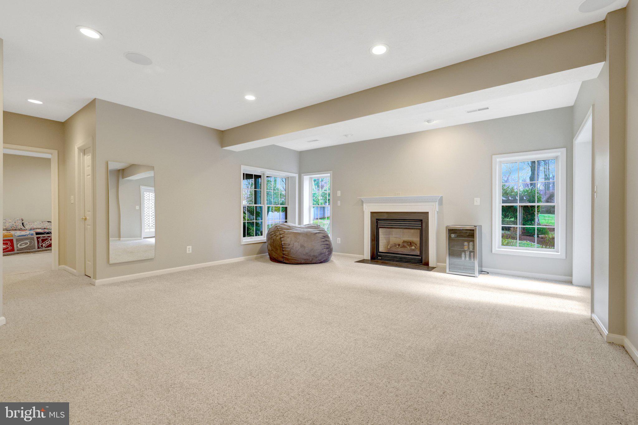 1827 Beulah Road Vienna, VA 22182 - Photo 58 of 91 a view of an empty room with a fireplace and a window