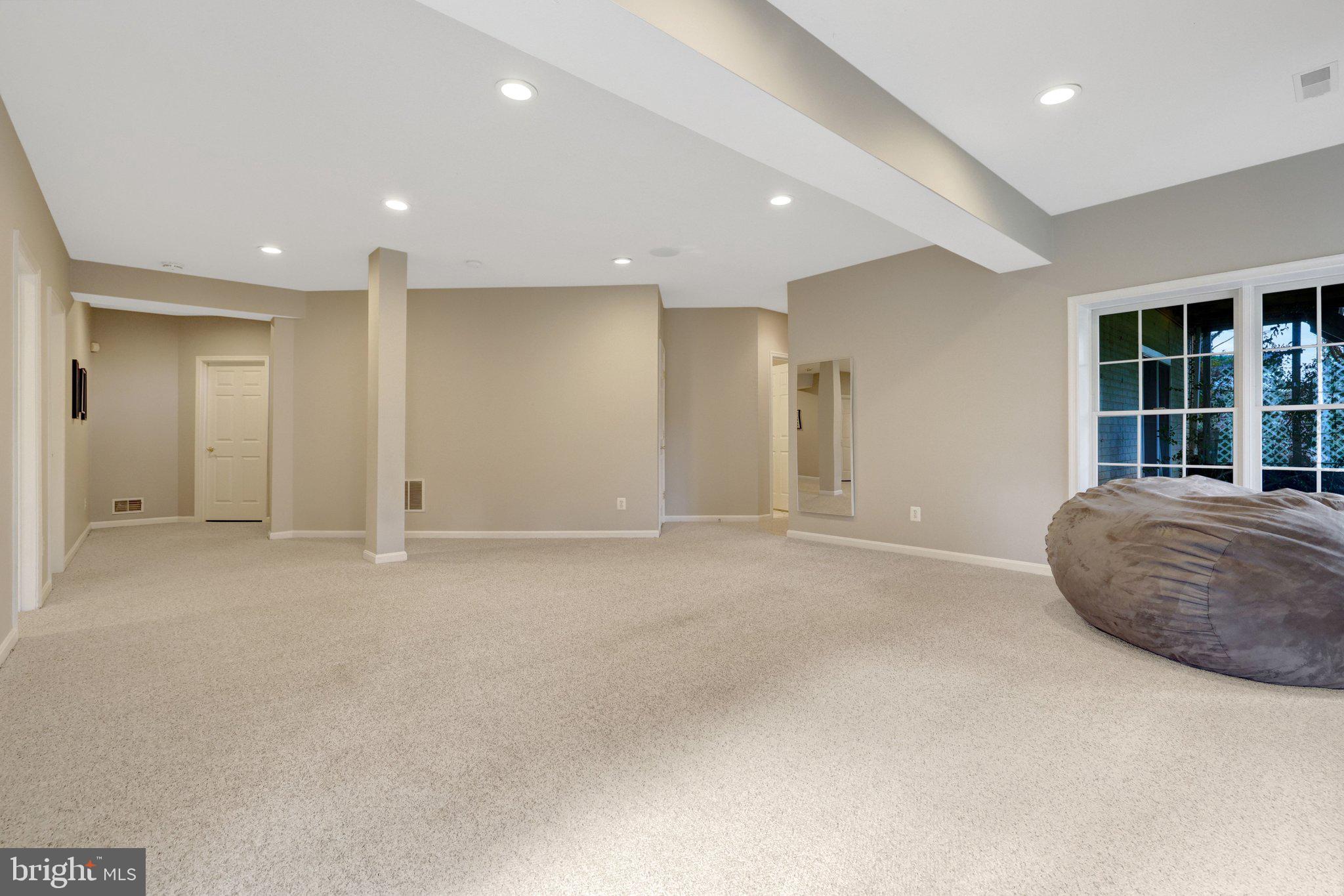 1827 Beulah Road Vienna, VA 22182 - Photo 59 of 91 an empty room with a cabinet and mirrors
