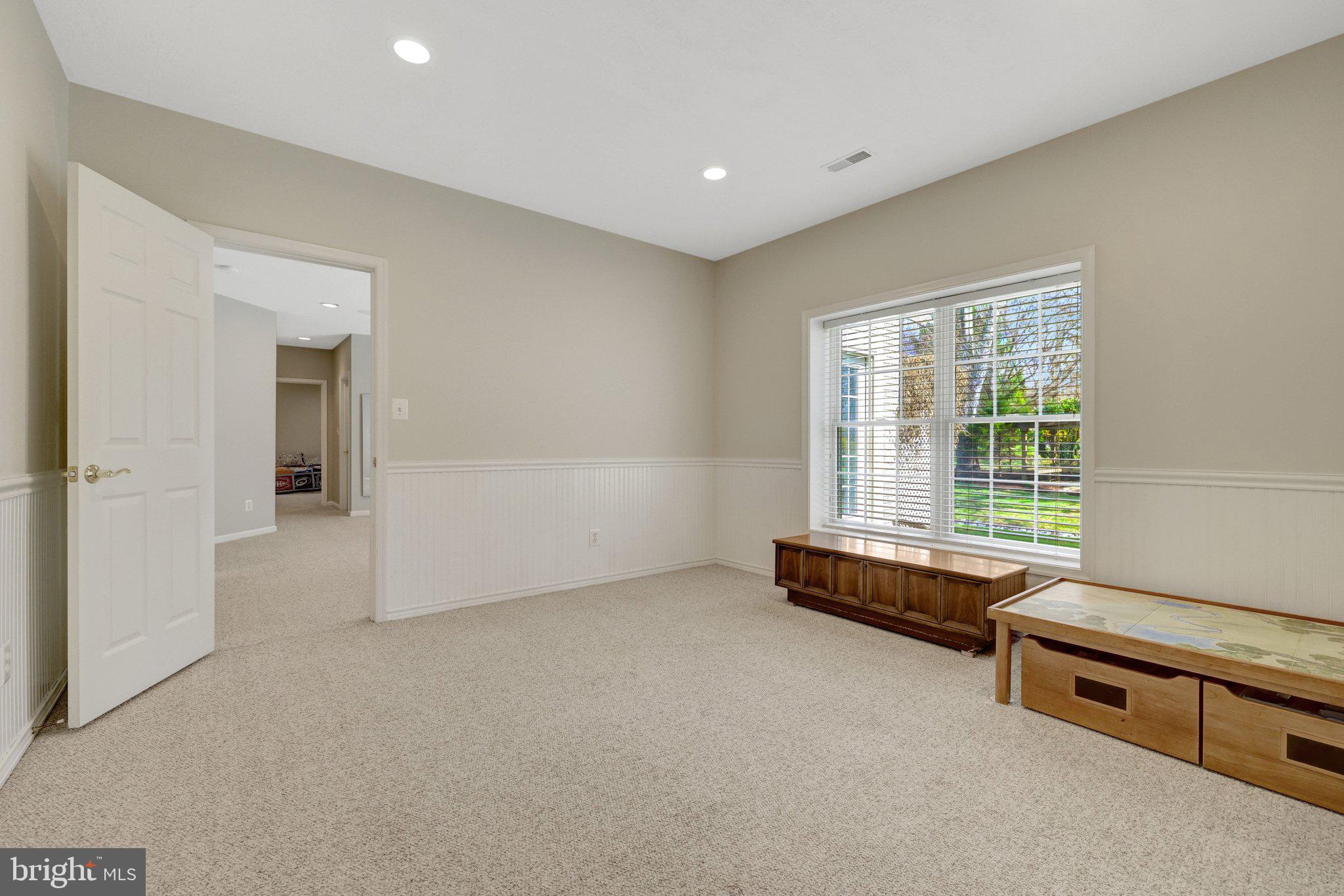 1827 Beulah Road Vienna, VA 22182 - Photo 64 of 91 a spacious bedroom with a bed and a window