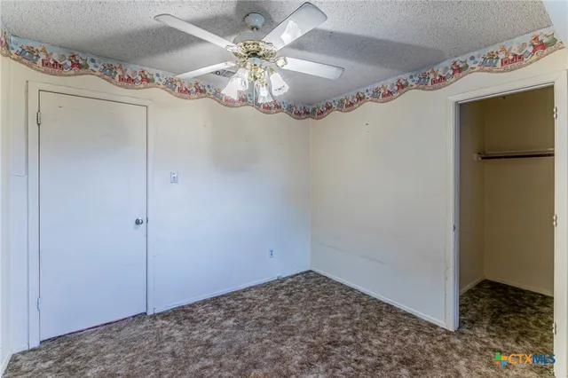 a view of a hallway with a chandelier