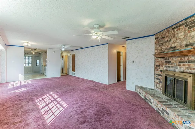 a view of livingroom and a fireplace