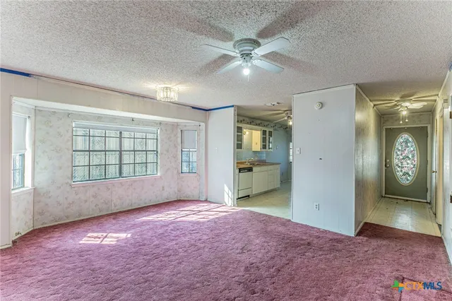 a view of livingroom with an entryway and a window
