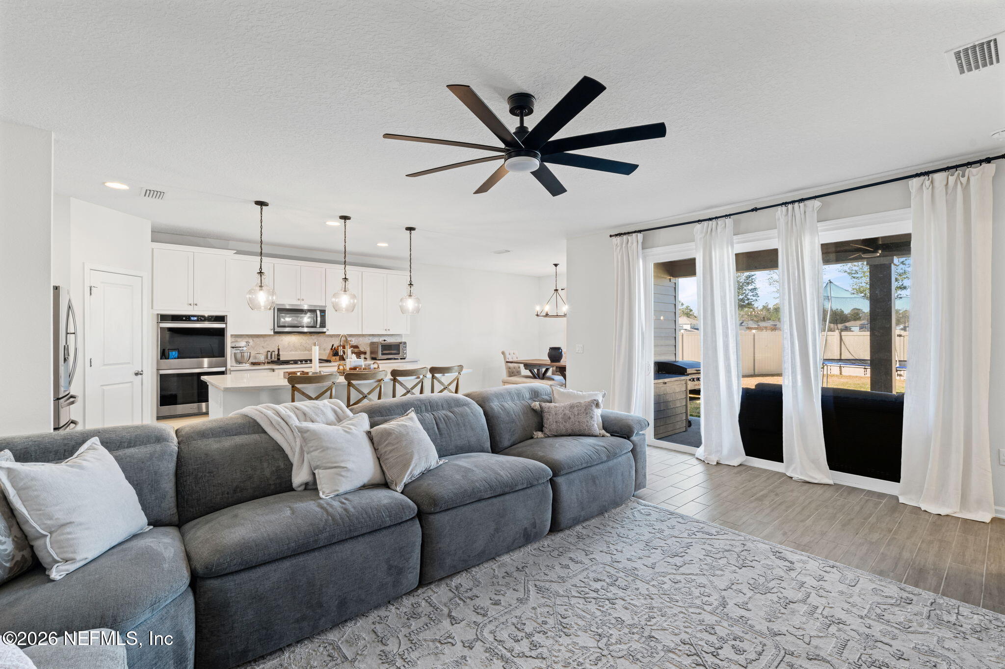 623 Ivory Palm Road Orange Park, FL 32073 - Photo 14 of 73 a living room with furniture and a large window