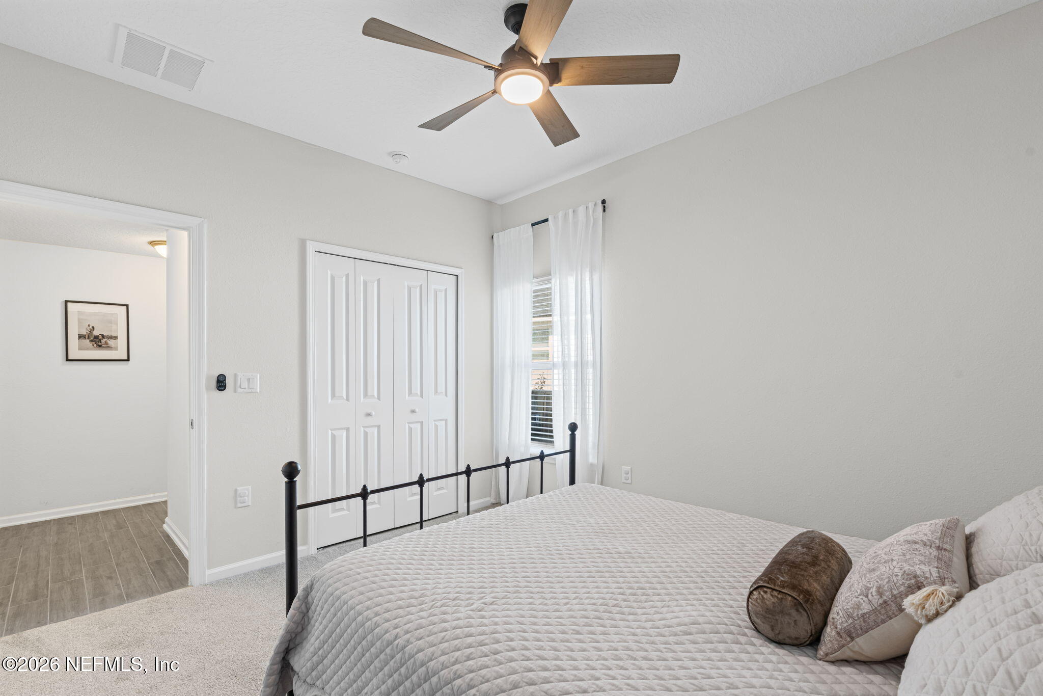 623 Ivory Palm Road Orange Park, FL 32073 - Photo 25 of 73 a bedroom with a bed and a ceiling fan