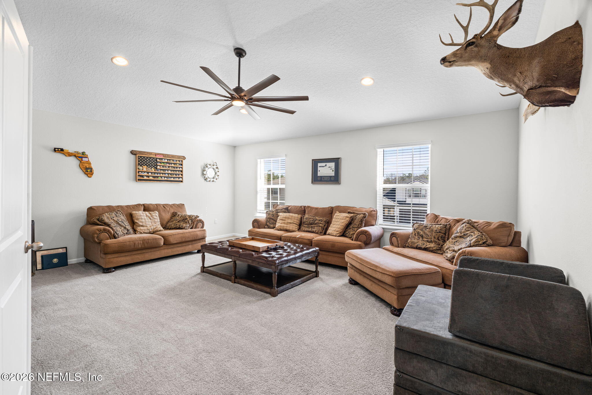 623 Ivory Palm Road Orange Park, FL 32073 - Photo 28 of 73 a living room with furniture and a ceiling fan